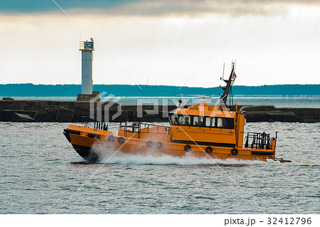 Orange pilot ship moving at speed 32412796