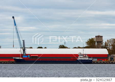 Blue cargo ship loading Blue cargo ship loading 32412987