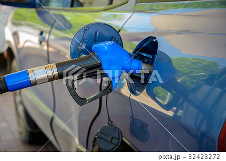 Car at gas station 32423272