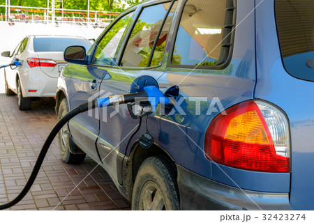 Car at gas station 32423274