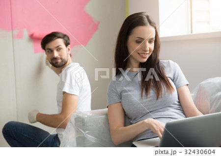 Young couple doing apartment repair together Young couple doing apartment repair together 32430604