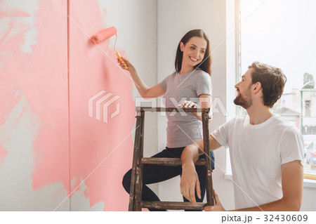 Young couple doing apartment repair together Young couple doing apartment repair together 32430609