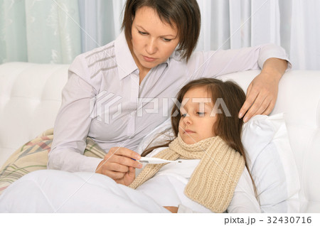 Mother taking care of daughter 32430716