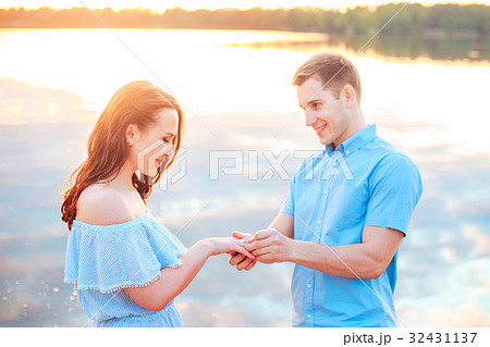 Marriage proposal on sunset. Betrothal  32431137