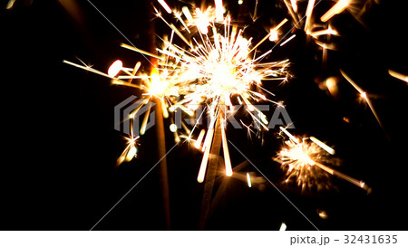 Burning Sparklers. Christmas and New Year lights. 32431635