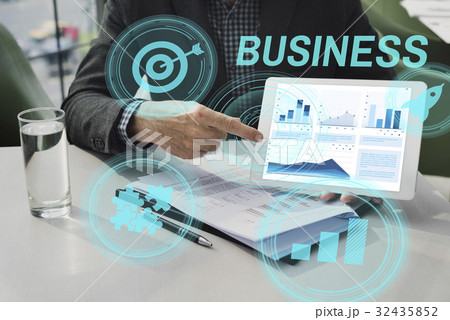 Hands working on digital device network graphic overlay 32435852