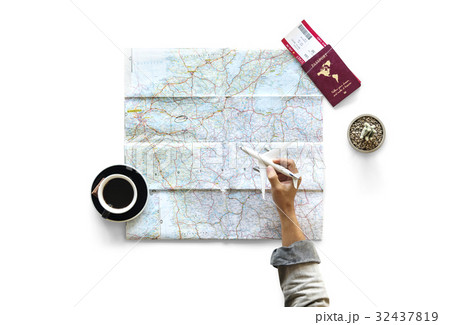 Hand holding toy airplane and planning travel destination 32437819