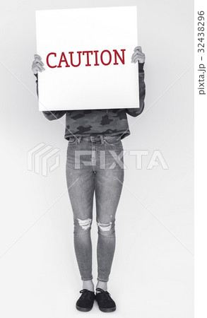 Woman hold caution alert sign Woman hold caution alert sign 32438296