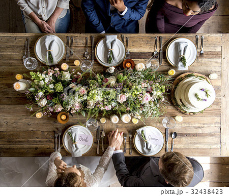 Bride and groom celebrate wedding ceremony with guests Bride and groom celebrate wedding ceremony with guests 32438423