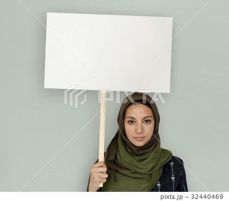 Arabian Woman Face Covered with Hijab Holding Board Sign Studio Portrait Arabian Woman Face Covered with Hijab Holding Board Sign Studio Portrait 32440469