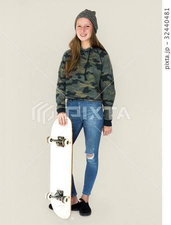 Young student girl standing with skateboard Young student girl standing with skateboard 32440481