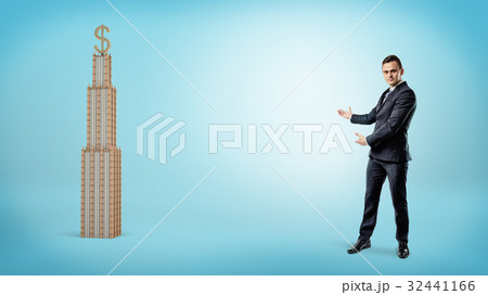A large businessman showing a business building 32441166