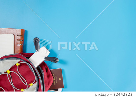 packing drone for vacation travel on blue 32442323