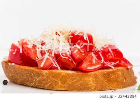 Bruschetta with tomatoes and grated parmesan. Bruschetta with tomatoes and grated parmesan. 32442884