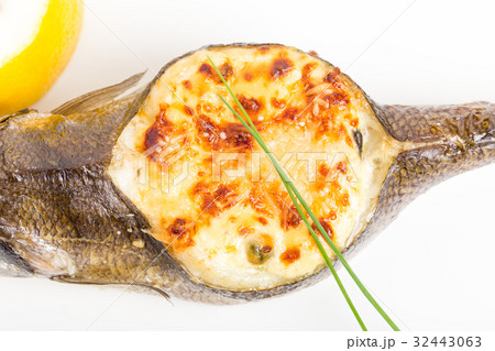 Baked sea bass with seafood and cheese. 32443063