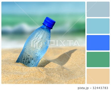 Water bottle on beach with palette color swatches 32443783