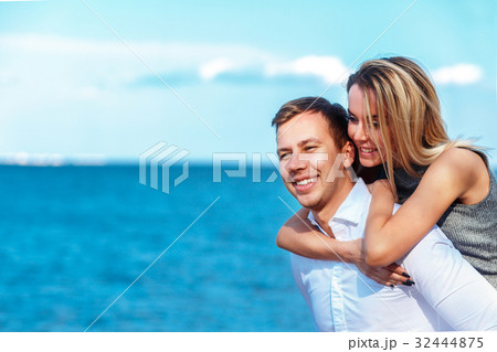 Happy couple on sea have fun on beach Happy couple on sea have fun on beach 32444875