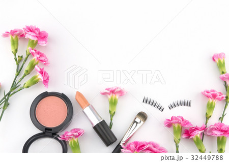 Cosmetic decorated with pink carnation flowers  32449788