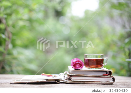 Tea in glass and notebook at outside Tea in glass and notebook at outside 32450430