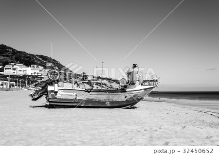 Stranded boat in the beach of Salema (Portugal) Stranded boat in the beach of Salema (Portugal) 32450652