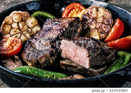 Appetizing beef steak in frying pan with the Appetizing beef steak in frying pan with the 32453964