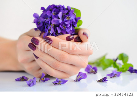 Hands of a woman with dark manicure on nails Hands of a woman with dark manicure on nails 32454222