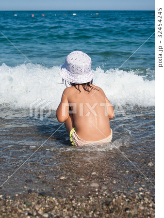 girl plays with waves girl plays with waves 32454245