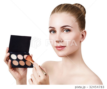 Young woman holding palette for contouring face. Young woman holding palette for contouring face. 32454783