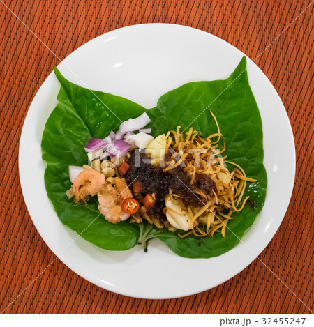 Thai appetizer leaf wrapped with herbs (Miang Kham 32455247