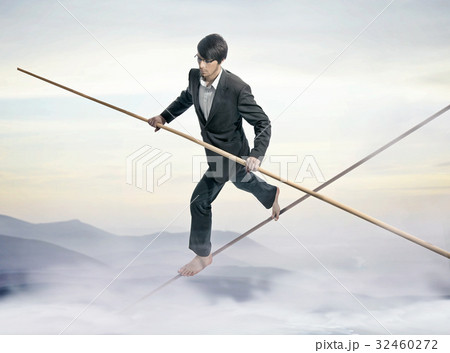 Conceptual picture of a businessman - slackliner 32460272