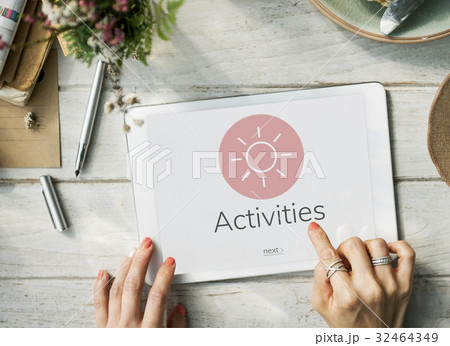 Hands working on digital device network graphic overlay 32464349