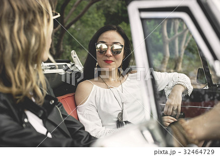 Women Couple Driving a Car Road Trip Together 32464729