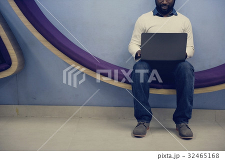 Man working on laptop networking technology 32465168