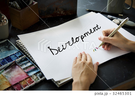 Hands working on notepad network graphic overlay Hands working on notepad network graphic overlay 32465301