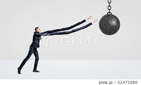 A businessman on white background trying to grab a 32471080