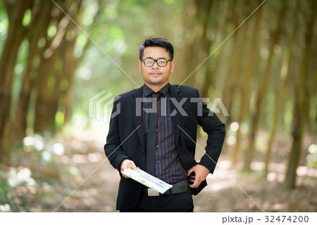 Plant researchers are checking latex rubber trees. 32474200