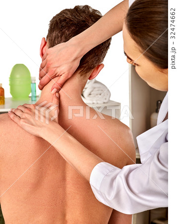 Shoulder and neck massage for woman in spa salon. Shoulder and neck massage for woman in spa salon. 32474662