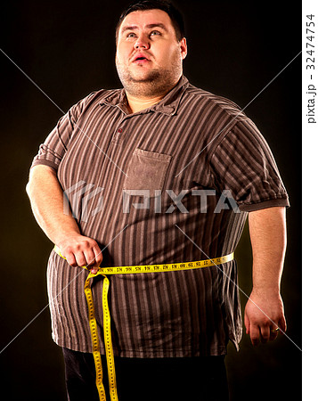Man belly fat with tape measure weight loss around Man belly fat with tape measure weight loss around 32474754