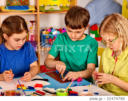 Small students girl painting in art school class. Small students girl painting in art school class. 32474780