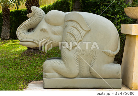 gray stone elephant statue on green grass gray stone elephant statue on green grass 32475680