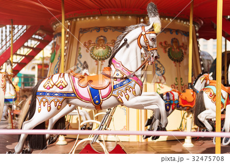 Horses on a carnival Merry Go Round. Old Frenchの写真素材