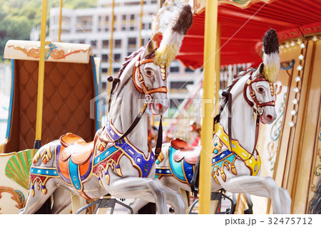 Horses on a carnival Merry Go Round. Old Frenchの写真素材