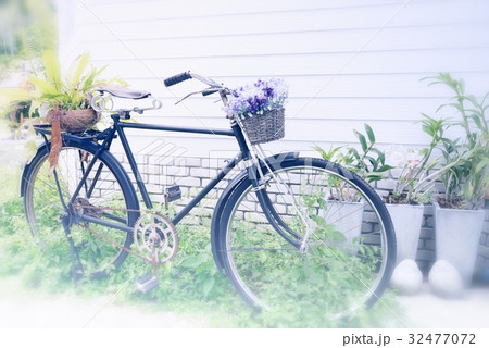 vintage bicycle used for a garden decoration 32477072