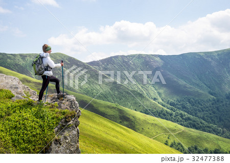 Young woman hiking in the mountains 32477388