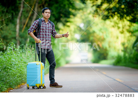 Backpacker is hitchhiking. Backpacker is hitchhiking. 32478883