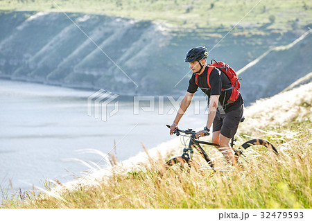 Traveler has adventur on meadow on riverside 32479593