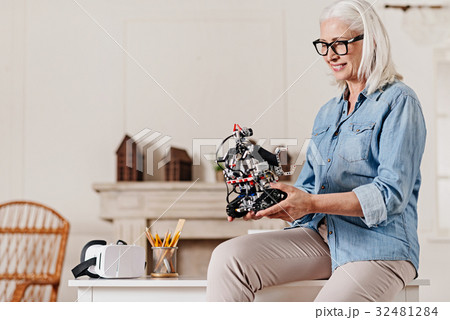 Positive female person looking at robot Positive female person looking at robot 32481284