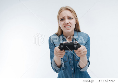 Upset young woman biting her lip Upset young woman biting her lip 32481447