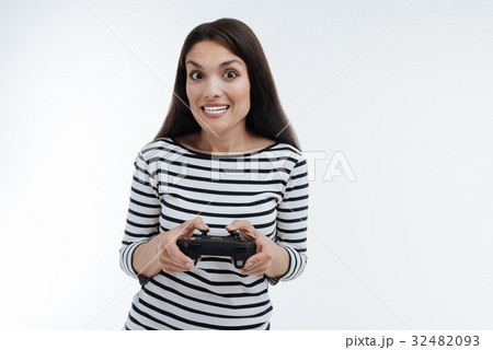 Surprised brunette showing her white teeth 32482093