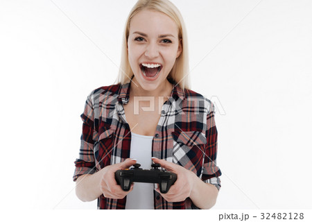 Funny girl playing with game console 32482128